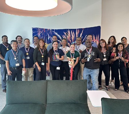 IT members posing for their Olympics group photo